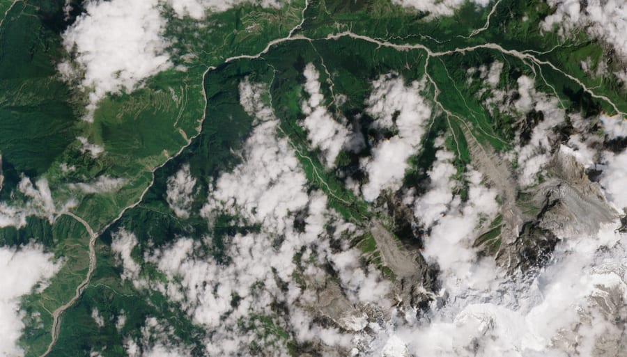 Sentinel-2 image of the same valley on 24 August 2026, forested and intact.